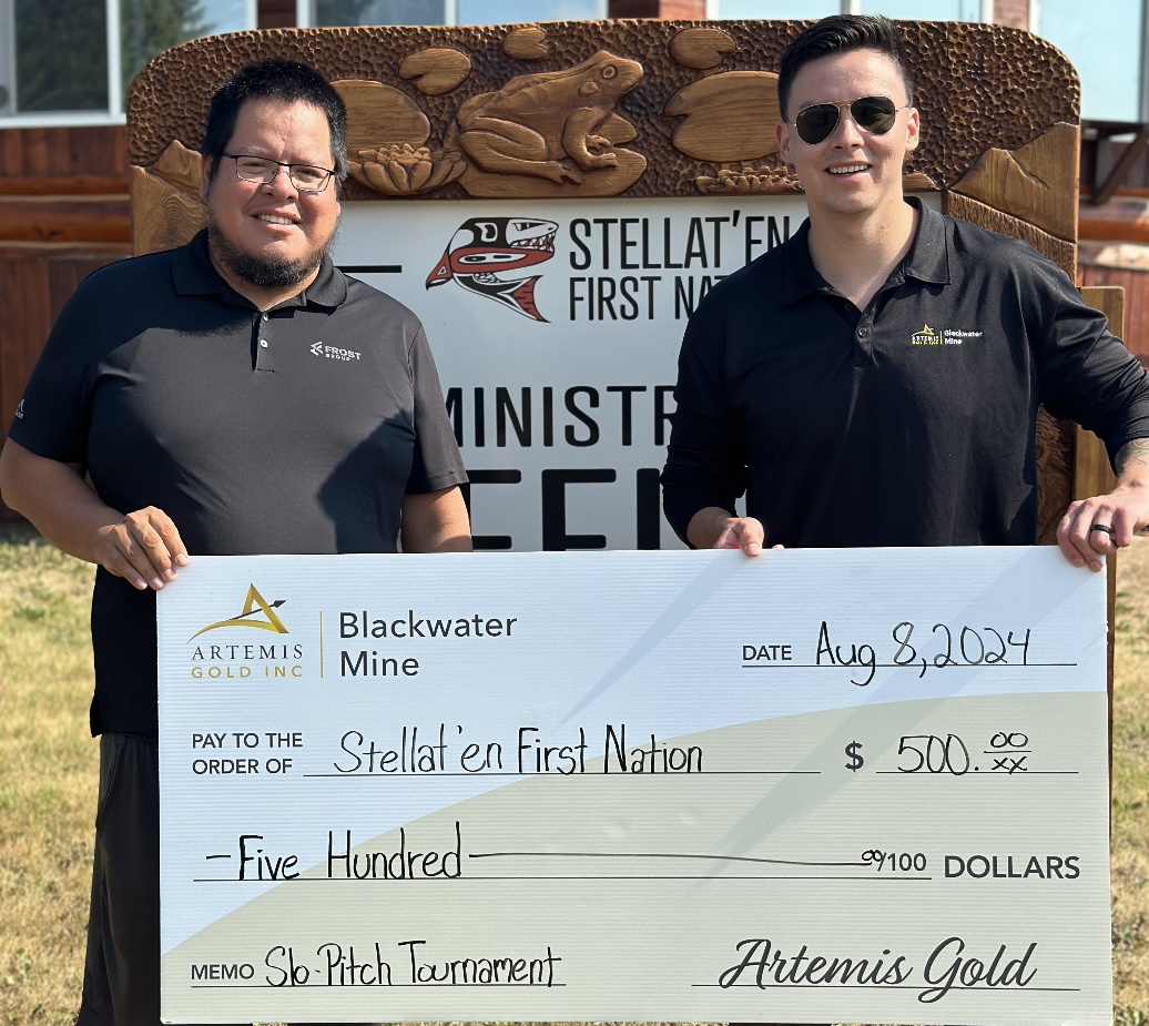 Damien Ketlo, Coordinator, Indigenous Relations, presents Elton Louis, Stellat'en First Nation Administration Assistant, with a cheque for the Stellat'en Slo-Pitch Tournament